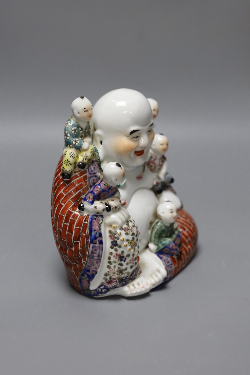 A Chinese Budai and boys group, 19 cms high.